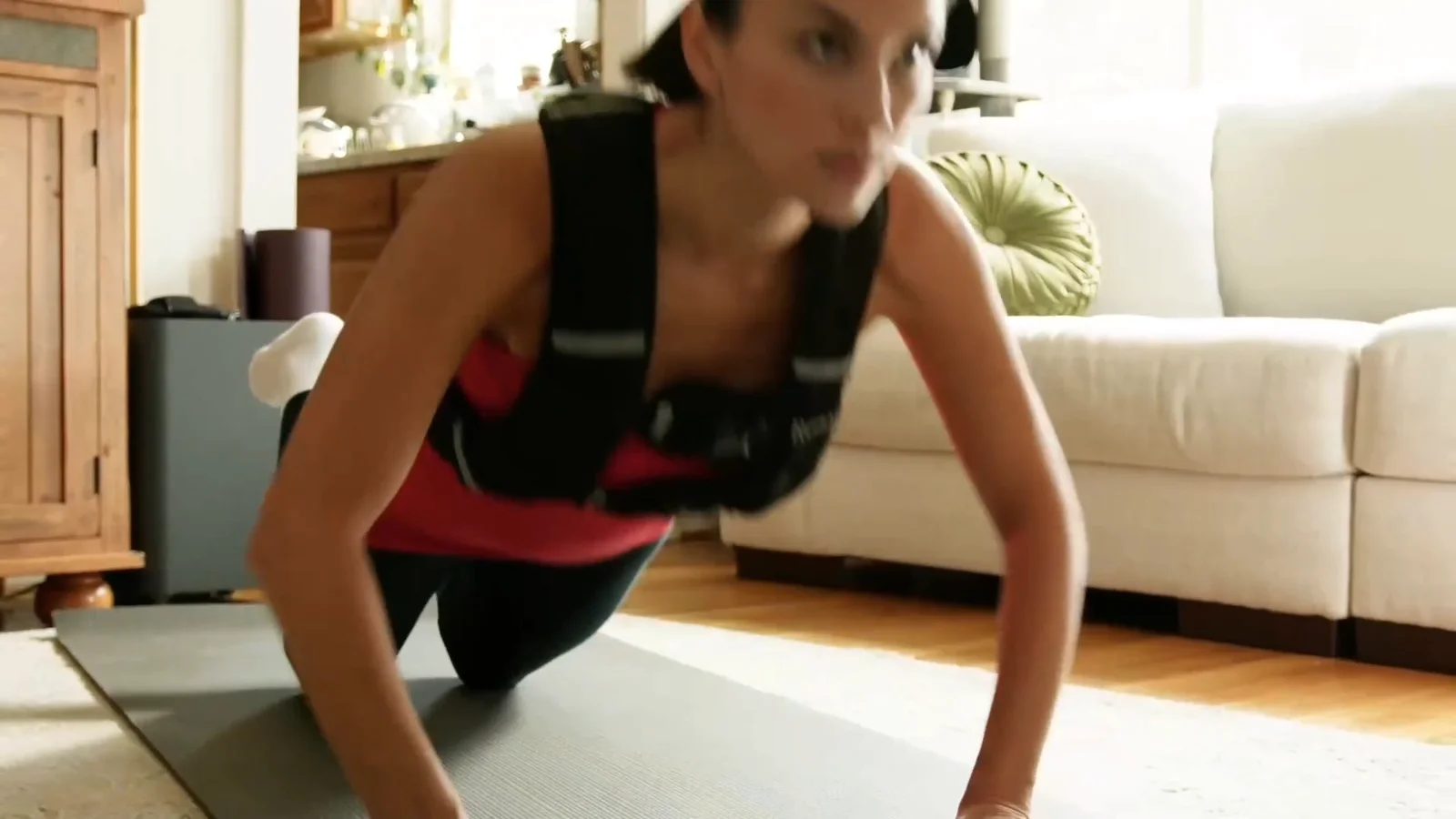 Push-ups at home in a Renoj weighted vest